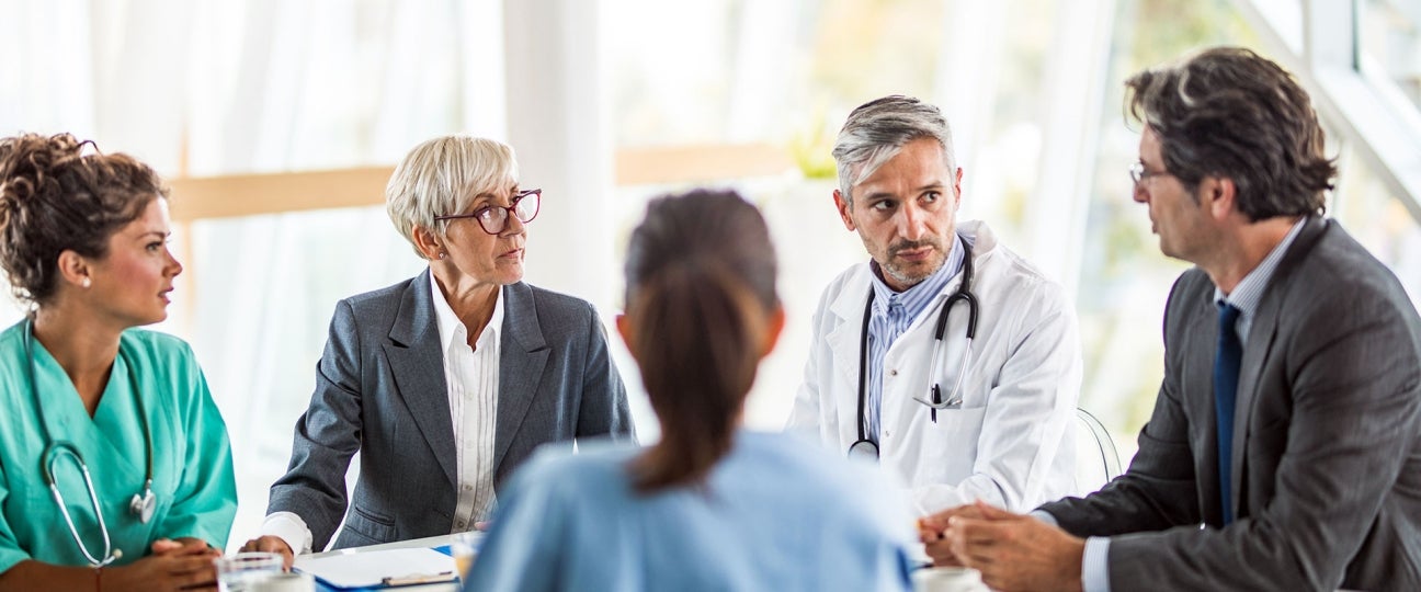 healthcare and business people in meeting