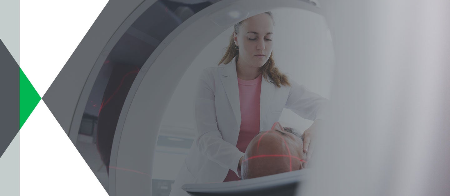 doctor watching over patient in MRI